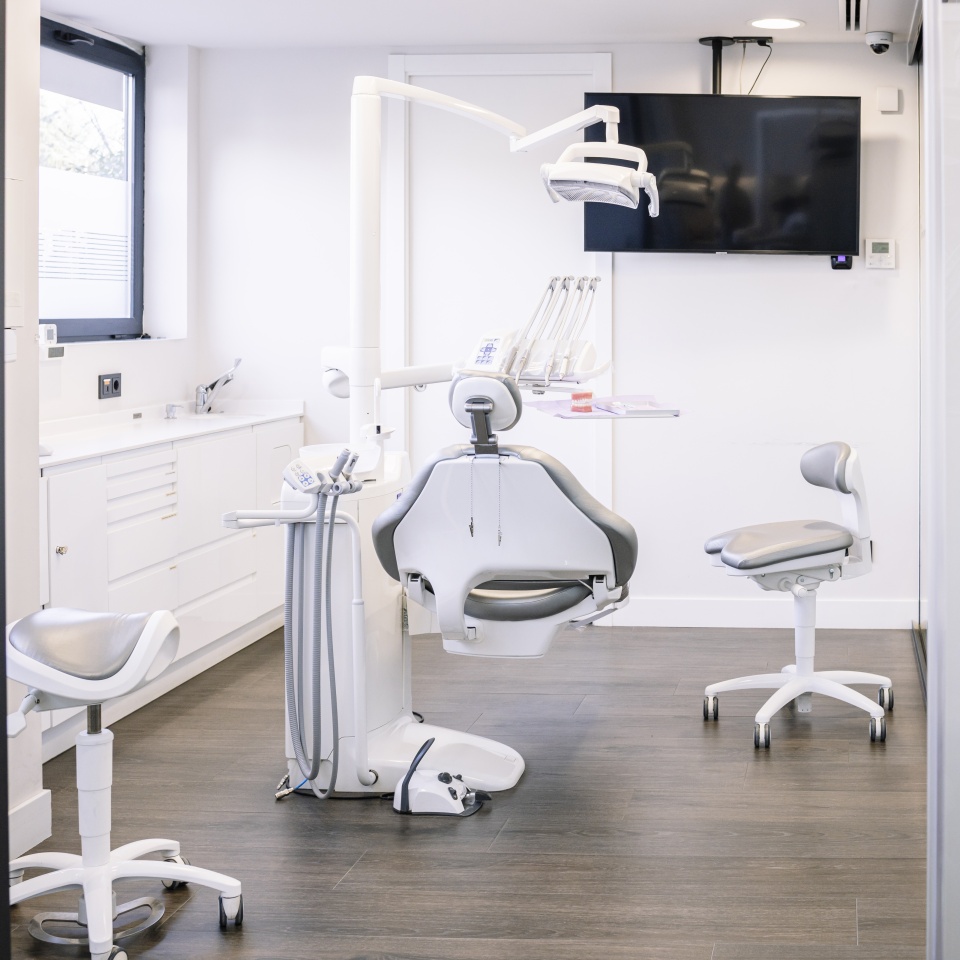 Leather dental chair with various medical instruments located in white dentist office. High quality photo